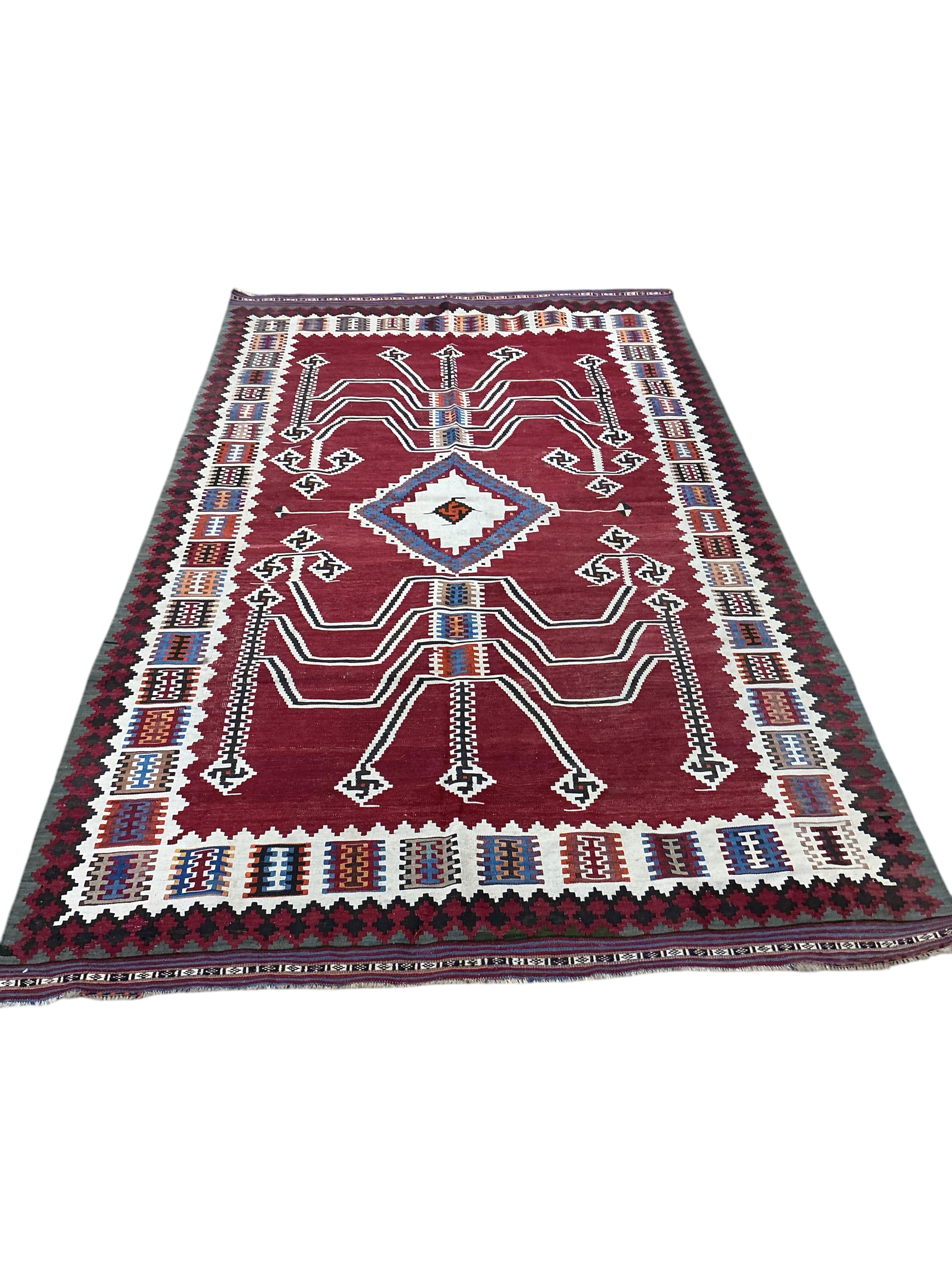 A Persian polychrome Kilim carpet, 284 x 160cm
